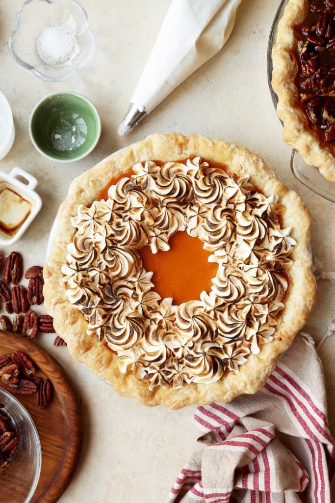 A whole sweet potato pie topped with toasted meringue