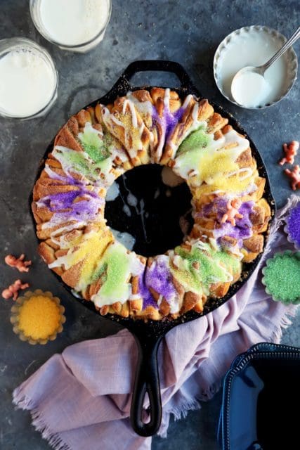 A New Orleans King Cake baked in a cast iron skillet