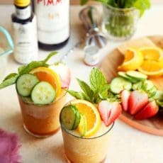 Best batch cocktail for summer blended and served in two glasses with fruit and mint