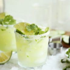 Cucumber and Cilantro Margarita in a small glass with salt.