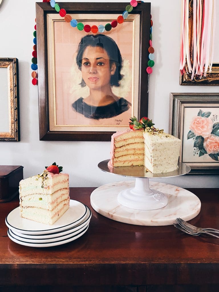 Sliced layer cake next to a portrait of Aunt Dede