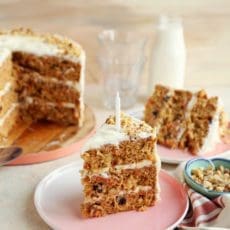 Huge slice of carrot cake on a plate.