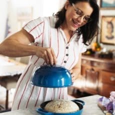 placing lid on easy rye bread boule in bread oven.