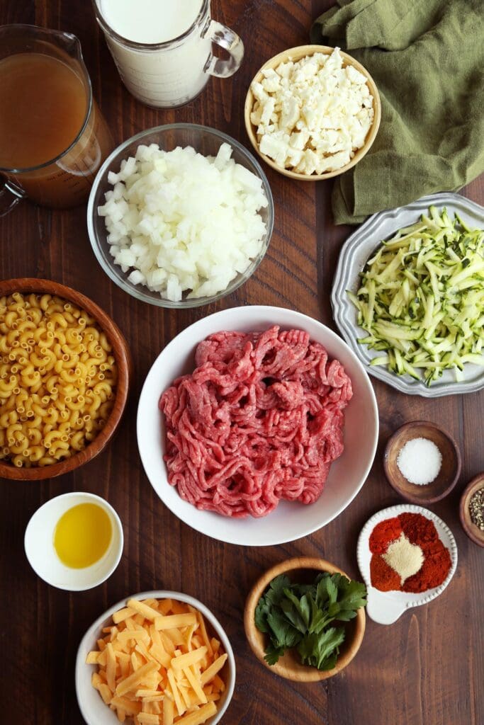 Ingredients for homemade hamburger helper in small bowls.