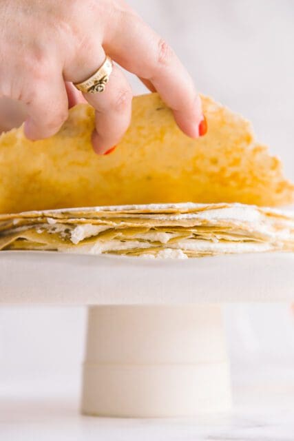 adding a layer of crepe on top of whipped cream
